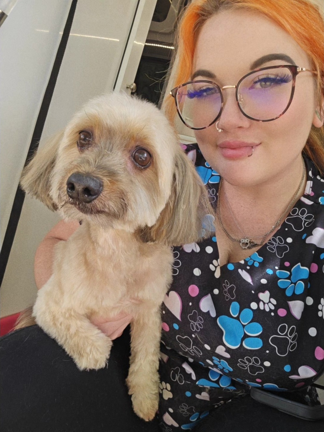 MJ, dog groomer in Fort Worth, with a happy dog